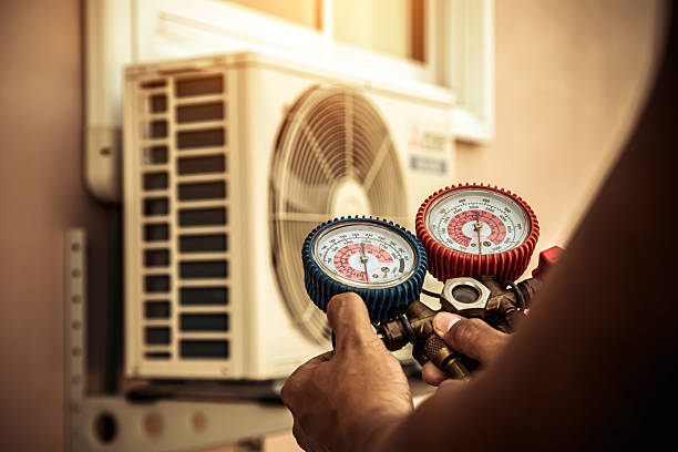 Professional Heat Pump Repair technician working in Owenton, KY
